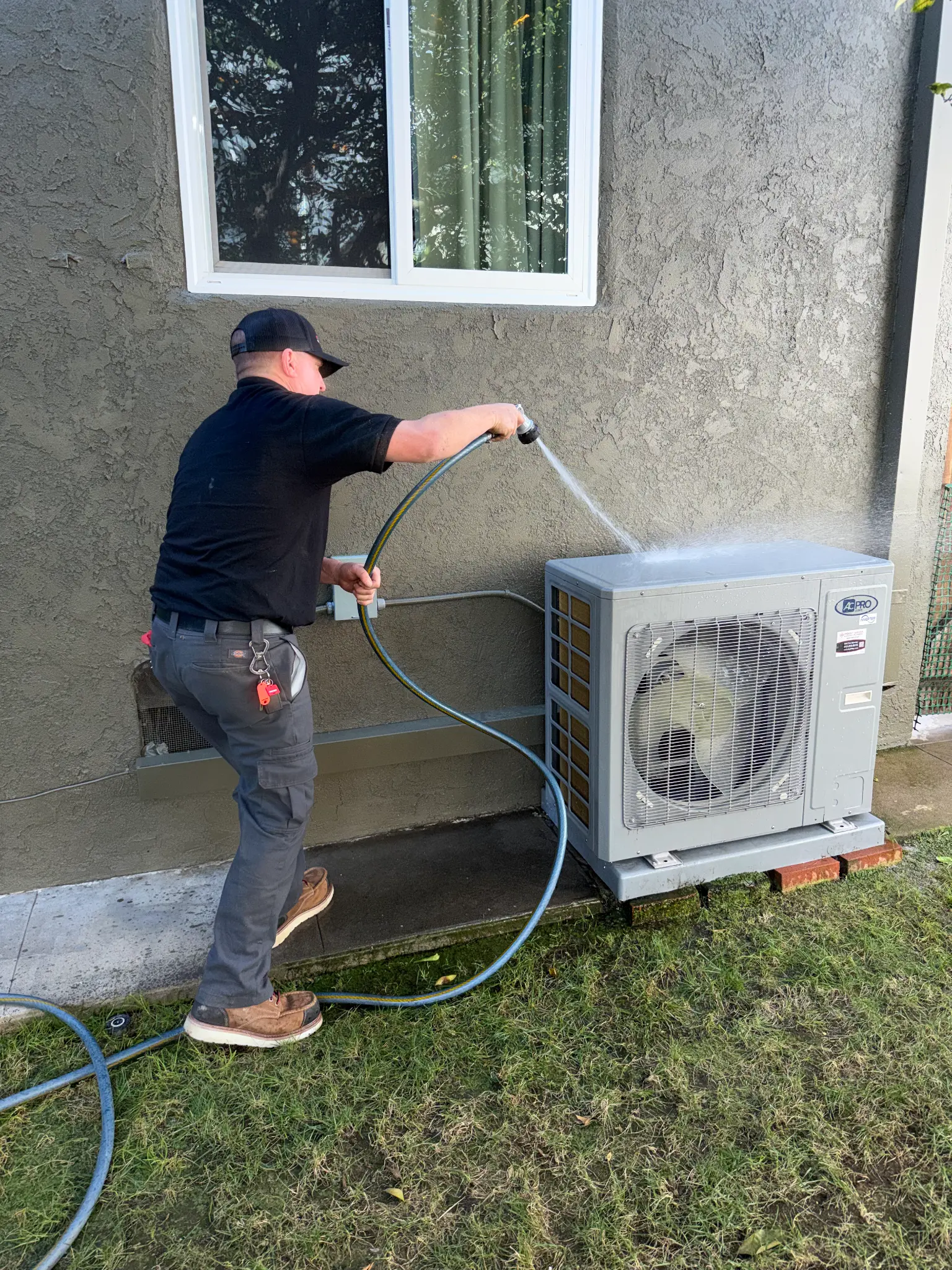 Point Loma HVAC technician servicing outdoor unit
